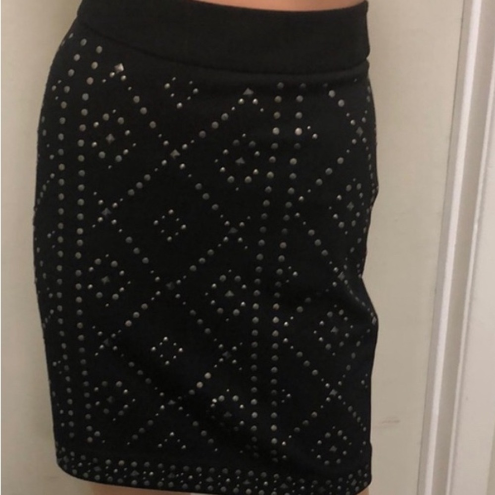 A black skirt with sicueen in front